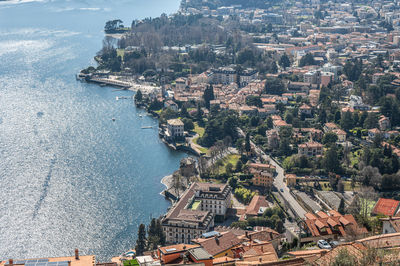 High angle view of townscape by sea