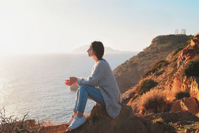 Man looking at sea against sky