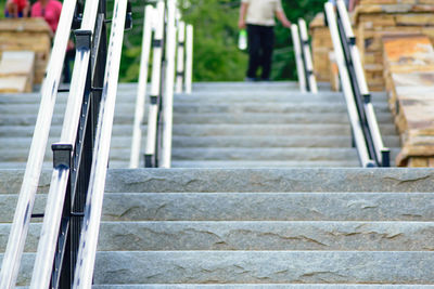 Low section of man walking on stairs