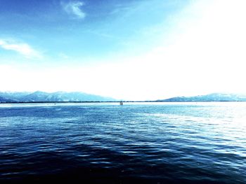 Scenic view of sea against blue sky