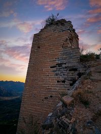 Low angle view of old building against sky