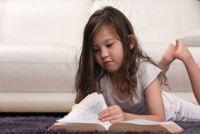 Portrait of a girl sitting on bed