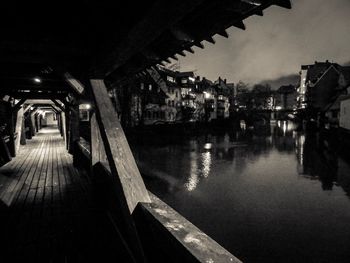 Reflection of illuminated bridge in water at night