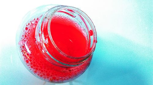 Close-up of red object over white background