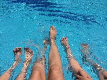 Low section of people in swimming pool