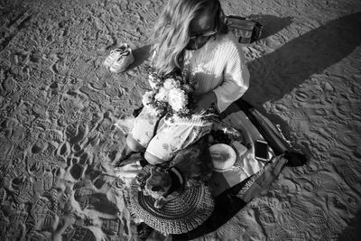 High angle view of girl sitting with toy