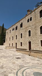 Low angle view of old ruins against clear sky