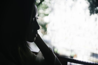 Portrait of a young woman looking away