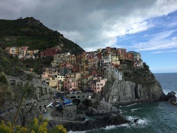 View of coastal town by sea