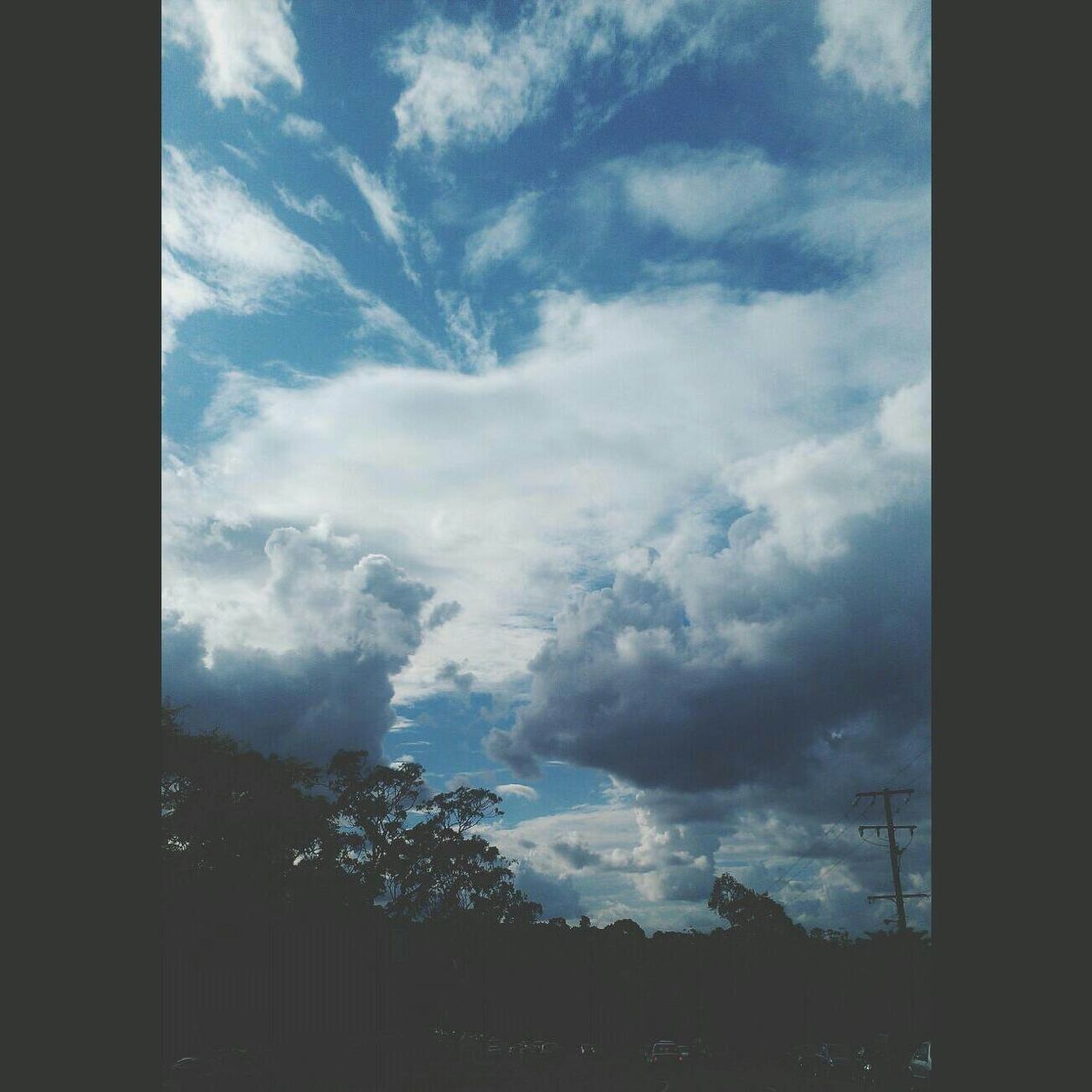 sky, cloud - sky, low angle view, cloudy, silhouette, cloud, built structure, building exterior, architecture, nature, tree, weather, no people, outdoors, day, beauty in nature, auto post production filter, window, dusk, blue