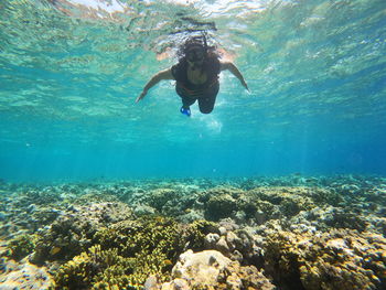 Woman swimming in sea