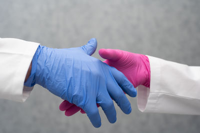 Cropped hand of doctor holding syringe