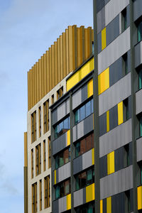 Low angle view of modern buildings against sky