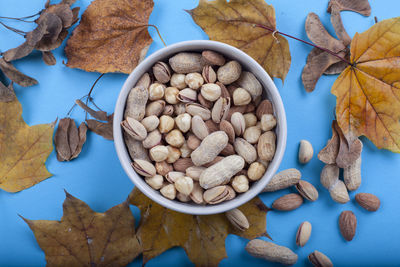 Directly above shot of nuts in bowl on table