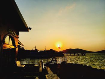 Silhouette of commercial dock at sunset