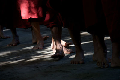 Low section of people standing on floor