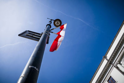 Low angle view of flags against sky