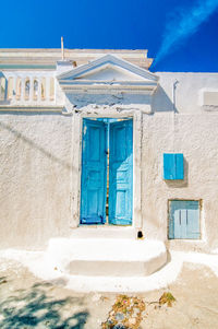 Typical blue door in emporio on the island of santorini, greece. dramatic toned