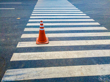 High angle view of traffic cone on crosswalk