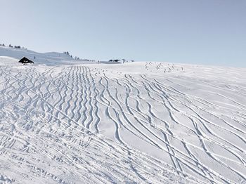 Scenic view of snow against clear sky