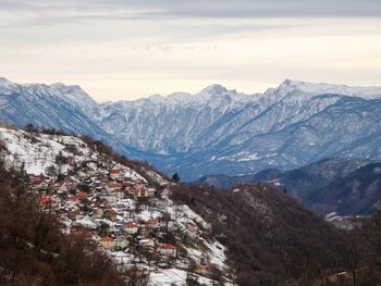 Scenic view of snowcapped mountains against sky