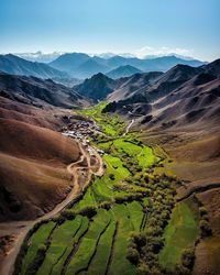 Scenic view of agricultural landscape against sky