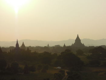 Panoramic view of temple building against sky during sunset