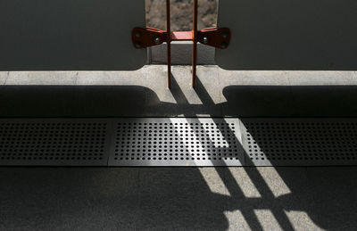 High angle view of bench on wall