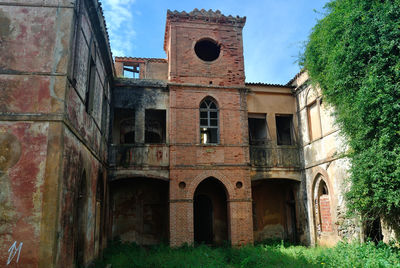 Low angle view of old building against sky