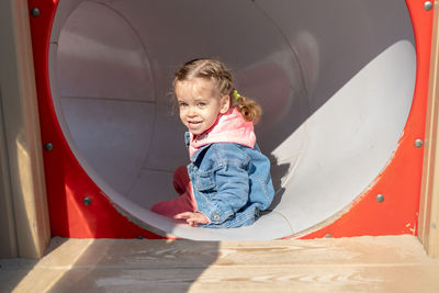 Portrait of girl playing in playground