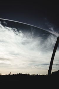 Low angle view of silhouette trees against sky