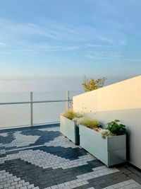 View of swimming pool by building against sky