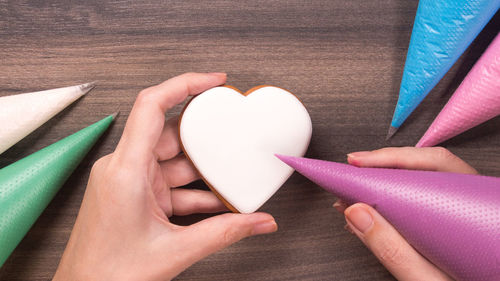 Cropped hand of person holding heart shape