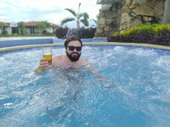 Portrait of man in swimming pool