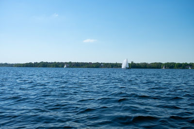 Scenic view of sea against blue sky