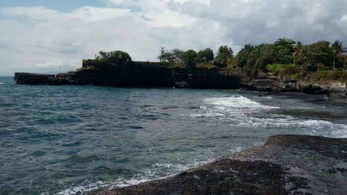 Scenic view of sea against cloudy sky