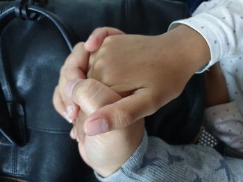 Close-up of woman holding hands