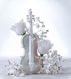 Close-up of white flower vase on table