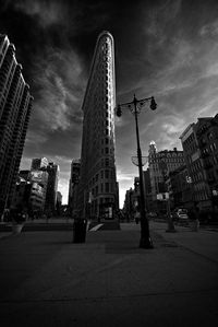 Skyscrapers against cloudy sky