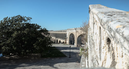 Arch bridge against clear sky