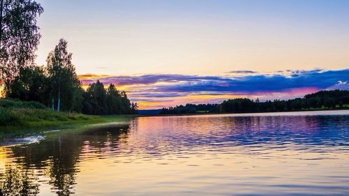 Scenic view of lake at sunset