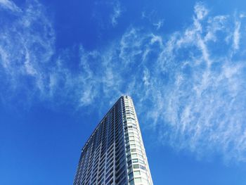 Low angle view of skyscraper against sky