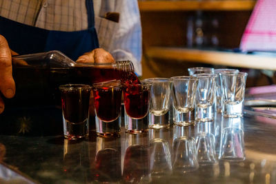 Close-up of wine glasses on table