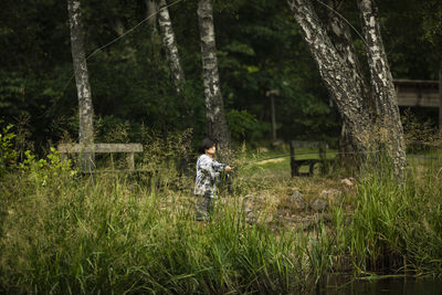 View of boy fishing