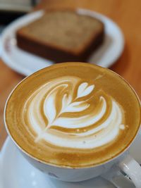 Close-up of cappuccino on table