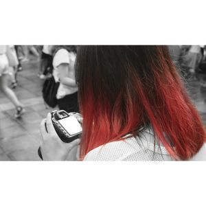 Rear view of woman using mobile phone