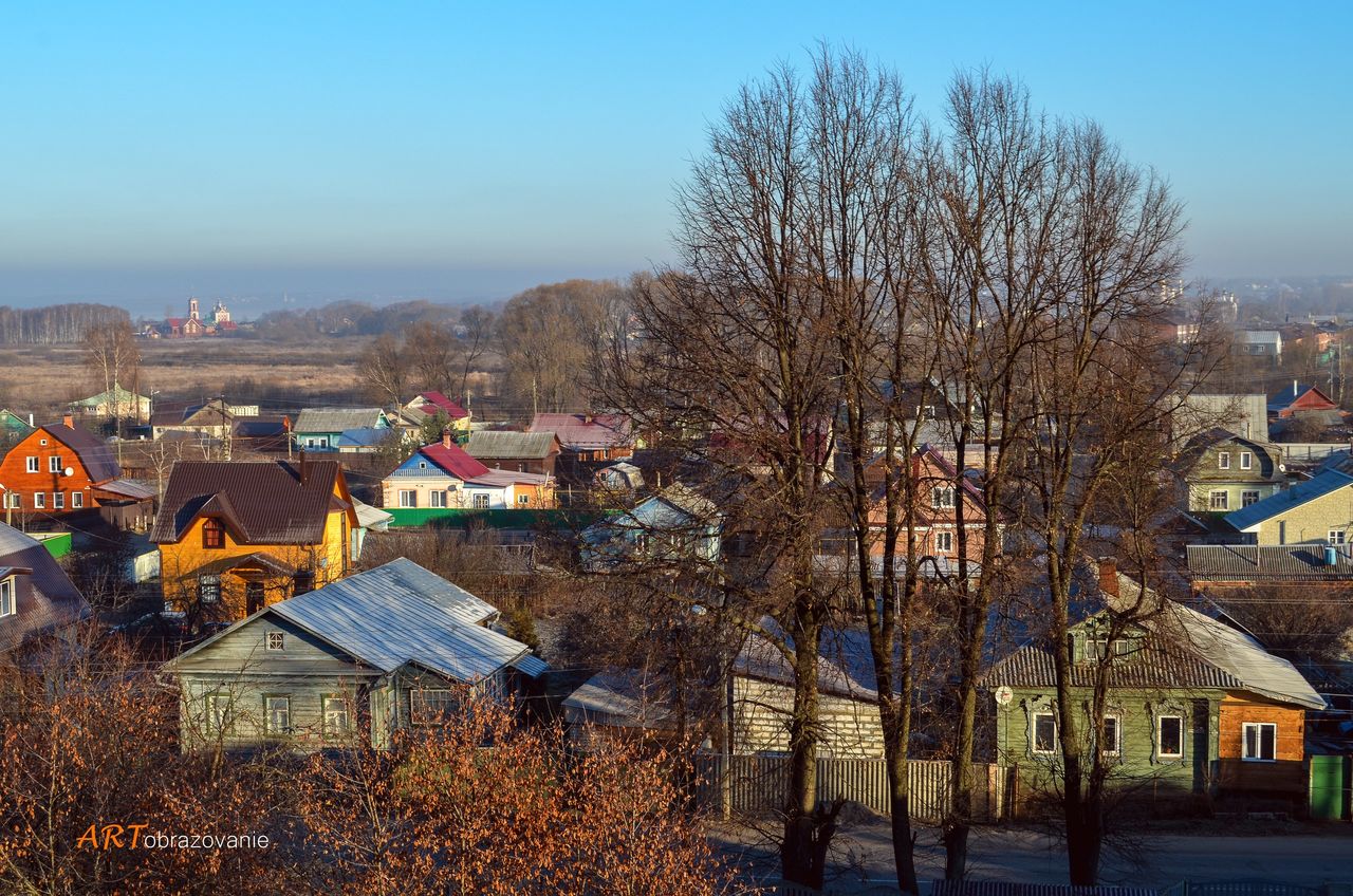 building exterior, architecture, built structure, tree, house, residential structure, clear sky, bare tree, residential building, snow, winter, residential district, city, season, town, blue, cold temperature, sky, outdoors, day