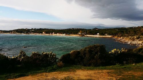 Scenic view of sea against cloudy sky