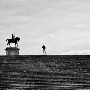 Low angle view of man standing on staircase