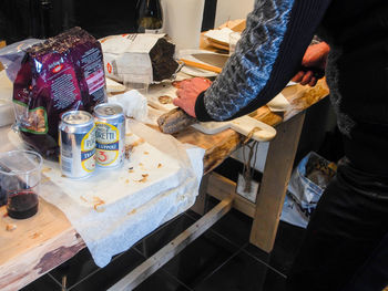 High angle view of woman preparing food on table